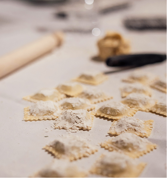Learn to make pasta, ravoli pasta strewn across a counter